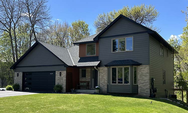 dark composite siding with metal wood accents