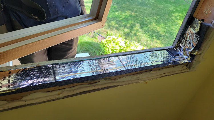 Full-frame window installation showing complete removal down to rough framing